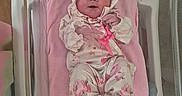 Keeley joined the competition — help win amazing prizes! newborn, baby, infant, bassinet, blanket, pink, hospital, sleeping, clothing, onesie, hood, cute, small, portrait, child, person, bed, soft, resting, indoors