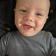 Aster joined the competition — help win amazing prizes! apparel, baby, child, closeup, cozy, cute, expression, eyes, face, happy, indoor, infant, mouth, person, portrait, shirt, skin, smiling, text, young