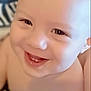 baby, blurry_background, bright, cheerful, child, close_up, cute, expression, face, happy, head, human, indoors, infant, person, portrait, skin, smiling, teeth, young