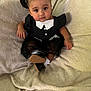 toddler, child, girl, black_dress, pigtails, bows, sitting, blanket, indoors, portrait, cute, face, eyes, shoes, white_collar, buttons, soft_texture, expression, baby, clothing