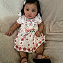 Arlette joined the competition — help win amazing prizes! baby, child, infant, girl, dress, floral_pattern, sandals, hair_clip, blanket, seated, indoors, cute, portrait, face, skin, hand, footwear, expression, comfortable, young