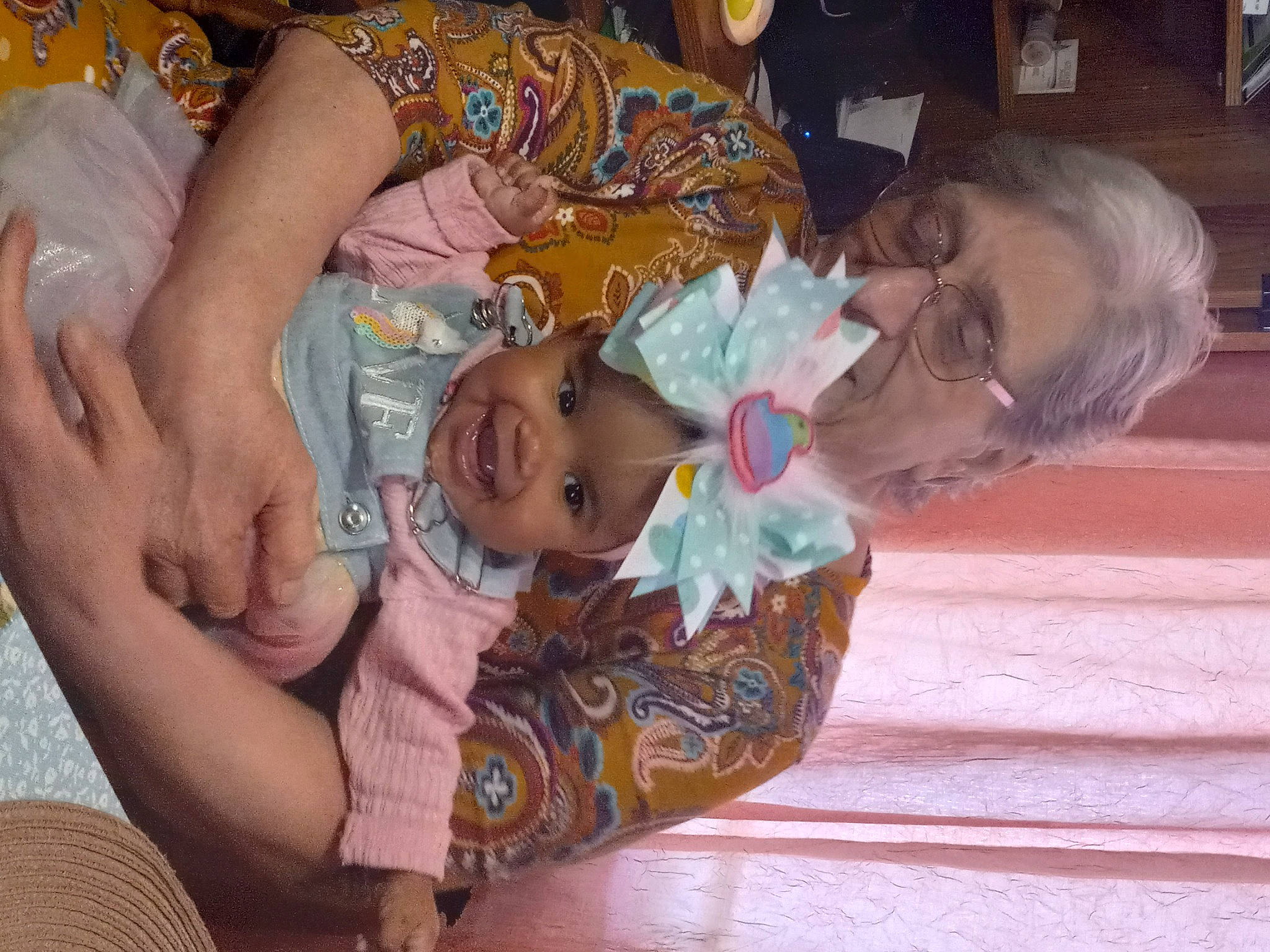 Lynaeah is registered to the contest to win money with this photo: abdomen, baby, cheek, chest, child, comfort, event, fun, happy, headwear, human_body, iris, mammal, mouth, pattern, person, room, shelf, skin, smile