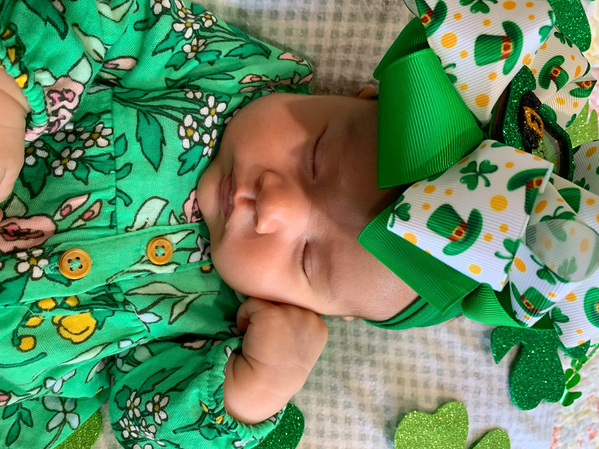 Melani is registered to the contest to win money with this photo: adaptation, baby, baby_toddler_clothing, child, comfort, grass, green, happy, headwear, linens, organism, pattern, people_in_nature, person, room, sleeve, smile, terrestrial_plant, textile, thumb