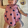 Milo joined the competition — help win amazing prizes! baby, infant, smiling, romper, striped_clothing, stars, milestone_card, blanket, celebration, 4th_of_july, cute, happy, lying_down, child, person, skin, head, arms, legs, foot