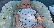 Milo joined the competition — help win amazing prizes! baby, infant, romper, pacifier, cushion, stars, tent, outdoor, relaxing, child, pattern, fabric, footwearless, cute, sun_pattern, comfort, soft, head, face, skin