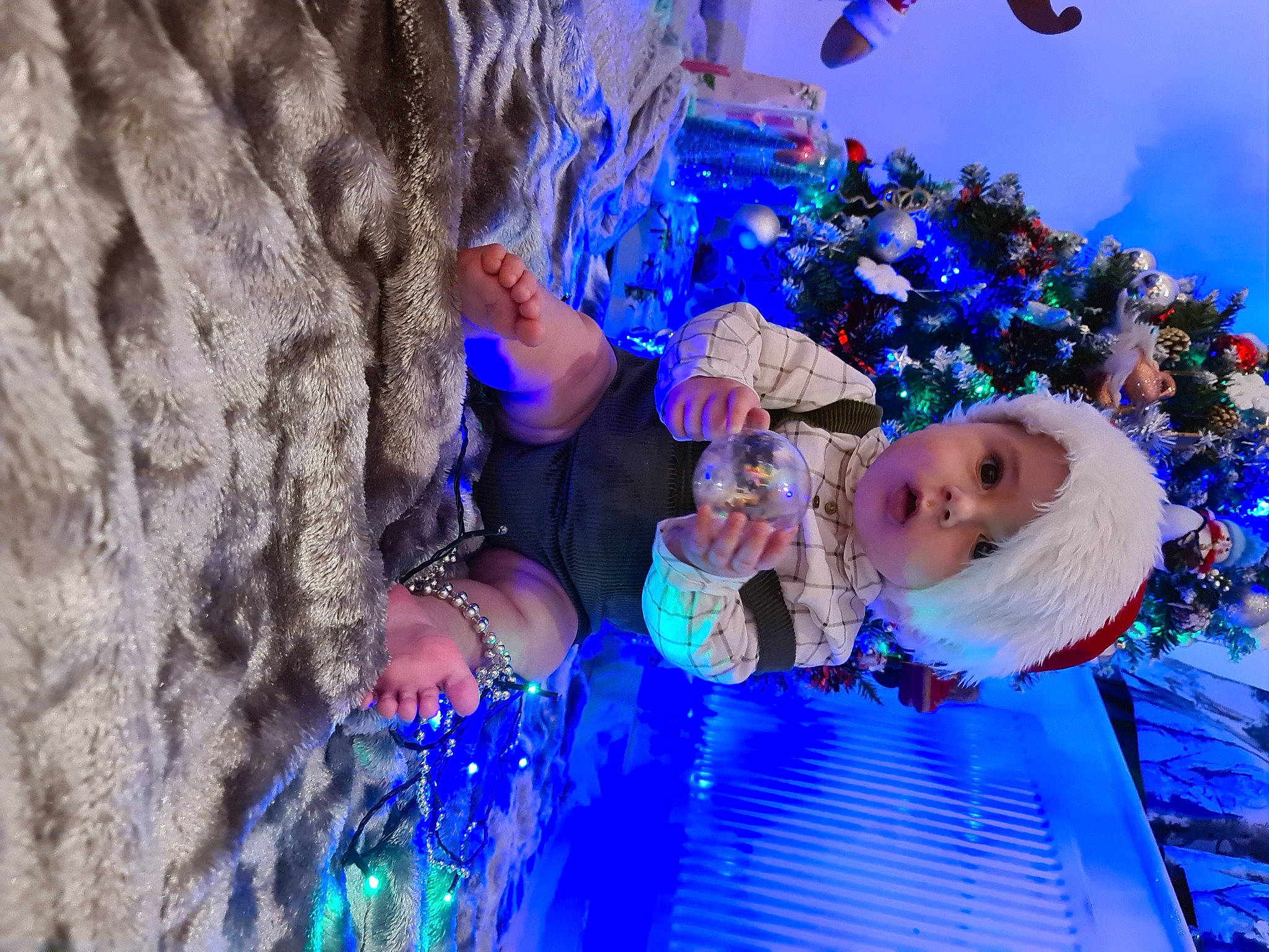 Mathias is registered to the contest to win money with this photo: azure, blue, christmas, christmas_decoration, christmas_eve, christmas_ornament, christmas_tree, electric_blue, event, fun, headwear, holiday, holiday_ornament, leisure, light, ornament, person, plant, purple, tree