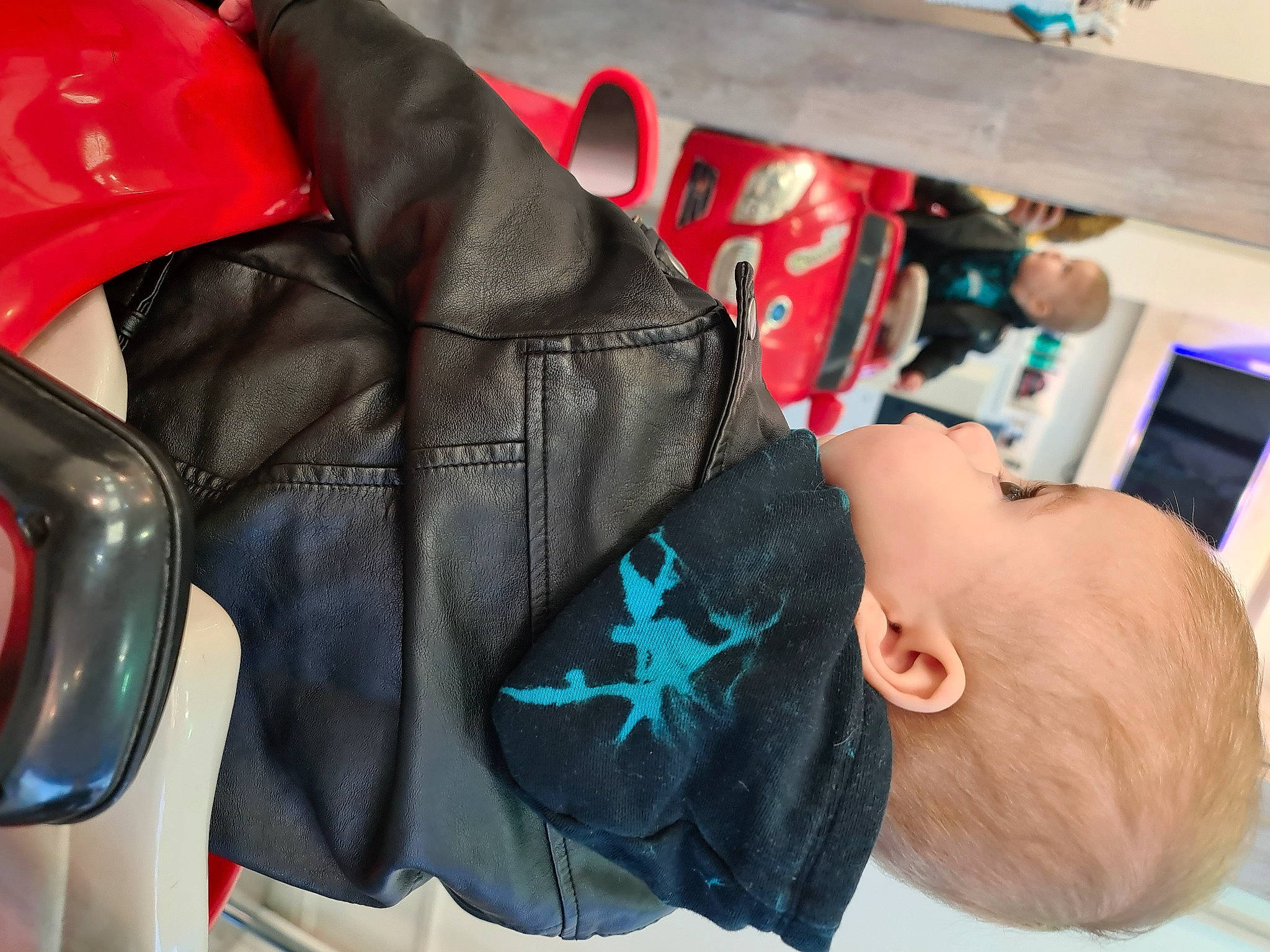 Mathias is registered to the contest to win money with this photo: automotive_design, automotive_exterior, automotive_lighting, baby, bag, carmine, electric_blue, fashion_accessory, jacket, leather_jacket, motor_vehicle, person, personal_luxury_car, personal_protective_equipment, red, sleeve, sportswear, street_fashion, textile, toddler