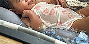 Reigny is registered to the contest to win money with this photo: baby, bathing, bathtub, bed, bodypart, clothing, crib, diaper, dress, face, finger, furniture, hand, head, infantbed, newborn, person, photography, portrait, tub