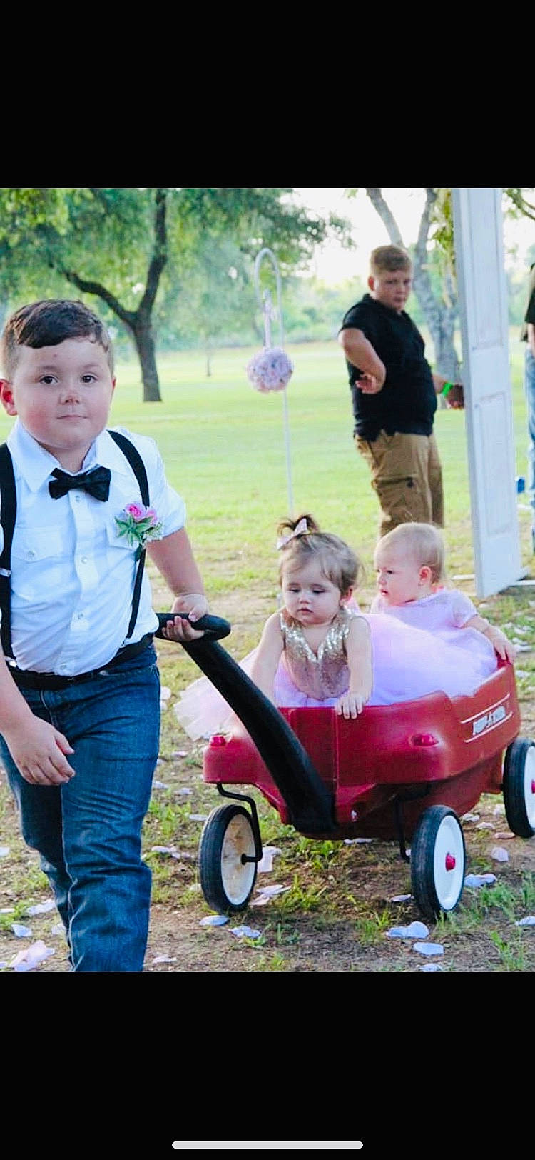 Brogan joined the competition — help win amazing prizes! baby_carriage, baby_products, child, fun, grass, happy, person, photography, play, product, riding_toy, toddler, vehicle, wagon
