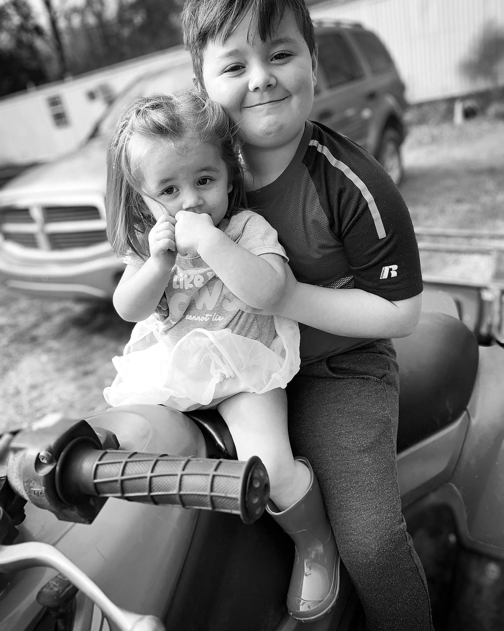 Brogan joined the competition — help win amazing prizes! black_and_white, car, child, family_car, happy, interaction, joy, luxury_vehicle, monochrome, monochrome_photography, people, person, photograph, photography, product, sibling, sitting, smile, snapshot, style