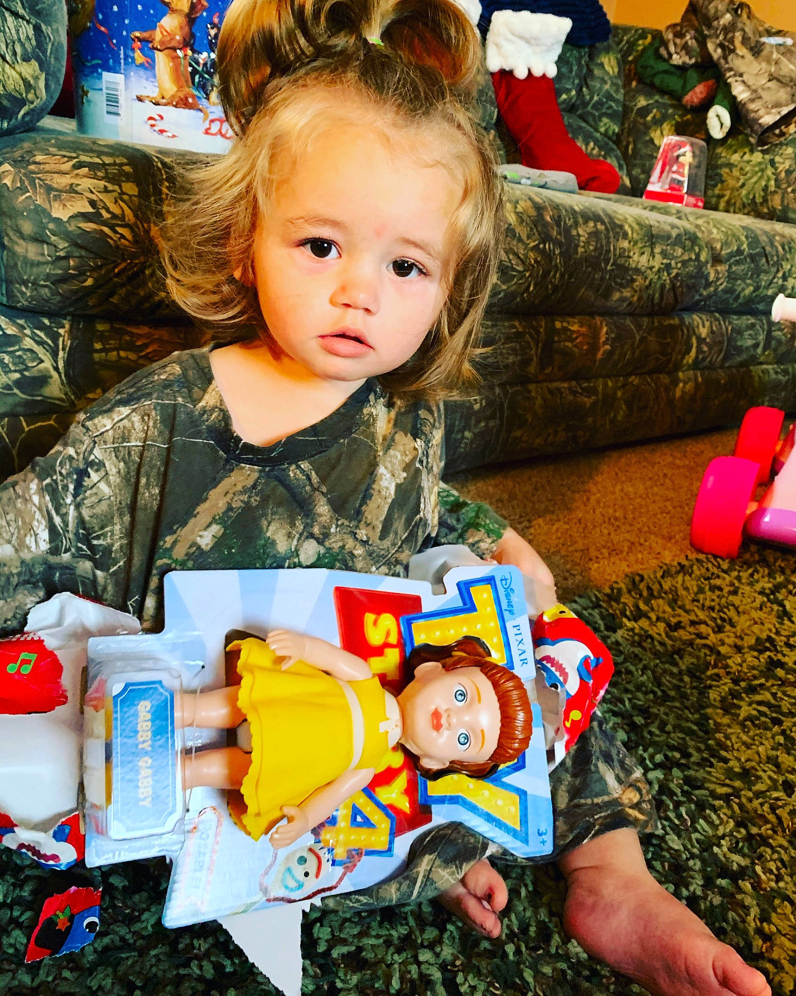 Kinleigh is registered to the contest to win money with this photo: baby, cheek, child, christmas_eve, family, happy, people, person, play, sitting, toddler, toy, tree, vacation