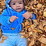 Kionna is registered to the contest to win money with this photo: baby, child, autumn, leaves, fall, blue_clothing, hooded_jacket, outdoor, nature, cute, infant, seasonal, playful, portrait, smiling, skin, face, hands, warm_clothing, leaf_pile