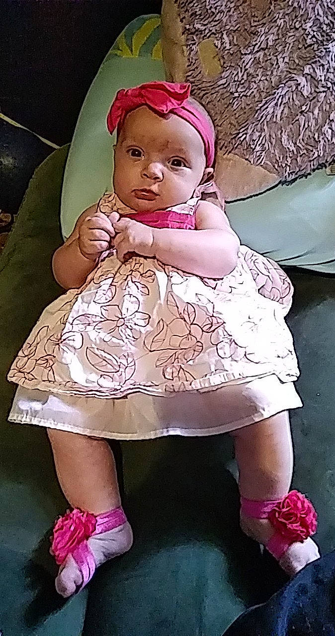 Kayleigh is registered to the contest to win money with this photo: baby, baby_toddler_clothing, cheek, day_dress, doll, dress, embellishment, hairstyle, head, iris, lip, magenta, person, pink, purple, skin, sleeve, textile, toy, violet