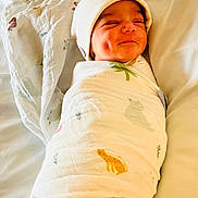 Agastya joined the competition — help win amazing prizes! baby, newborn, swaddled, blanket, beanie, smile, dimple, bed, white, cute, animal_print, soft, cozy, infant, child, resting, sleepy, happy, wrapped, portrait