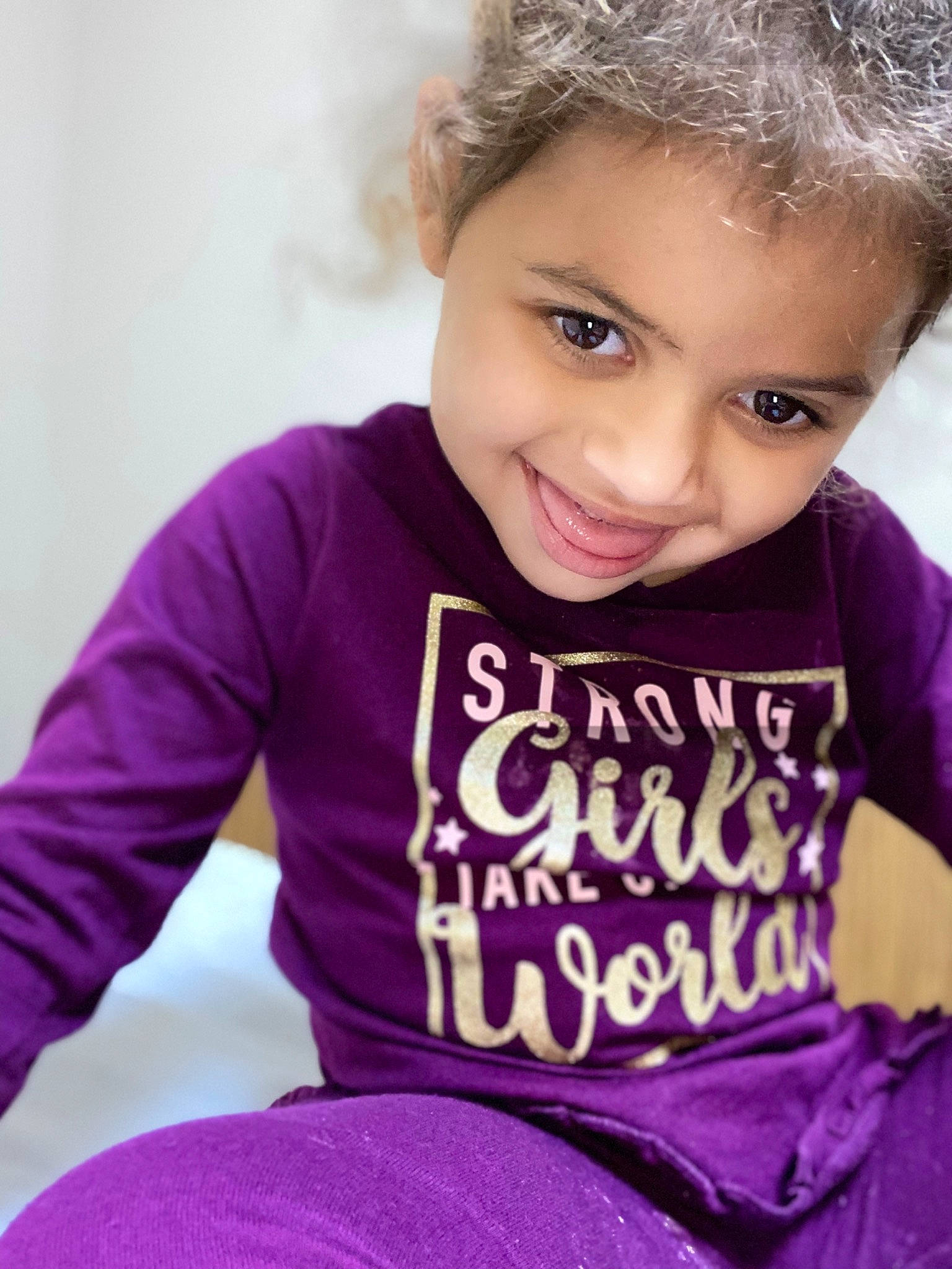 Claudia is registered to the contest to win money with this photo: baby_toddler_clothing, cool, eye, face, hair, hairstyle, happy, head, human_body, joy, magenta, neck, outerwear, person, pink, shirt, skin, sleeve, smile, sportswear