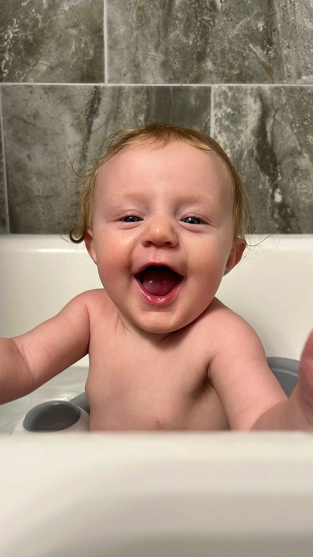 Arya is registered to the contest to win money with this photo: baby, child, bathtub, smile, happy, water, skin, face, joy, splash, bathroom, tile, cute, infant, expression, playful, young, portrait, arm, fun
