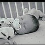 baby, sleeping, pacifier, crib, toy, infant, peaceful, monochrome, bed, child, sleep, cute, resting, soft_toy, closeup, indoors, calm, newborn, blanket, portrait