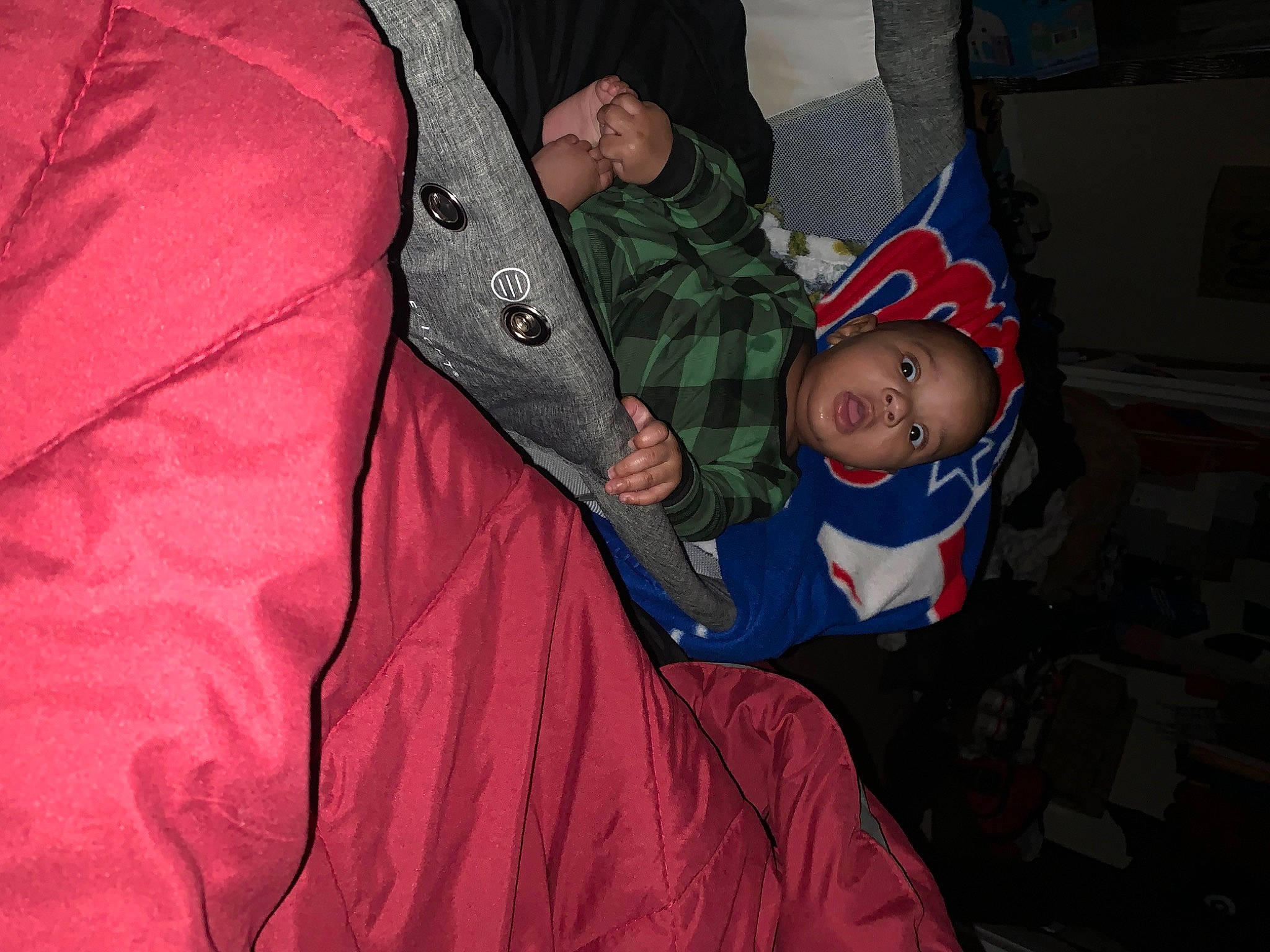 Zak is registered to the contest to win money with this photo: baby, baby_products, carmine, christmas_eve, comfort, costume, event, fictional_character, fun, hat, holiday, human_body, lap, linens, magenta, person, room, sitting, sleeve, toddler