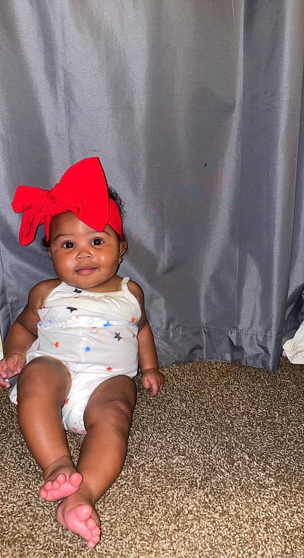 Averi joined the competition — help win amazing prizes! baby, baby_products, baby_toddler_clothing, barefoot, child, fashion_accessory, foot, fun, grass, happy, headwear, human_leg, joy, magenta, pattern, person, sandal, sitting, sleeve, smile