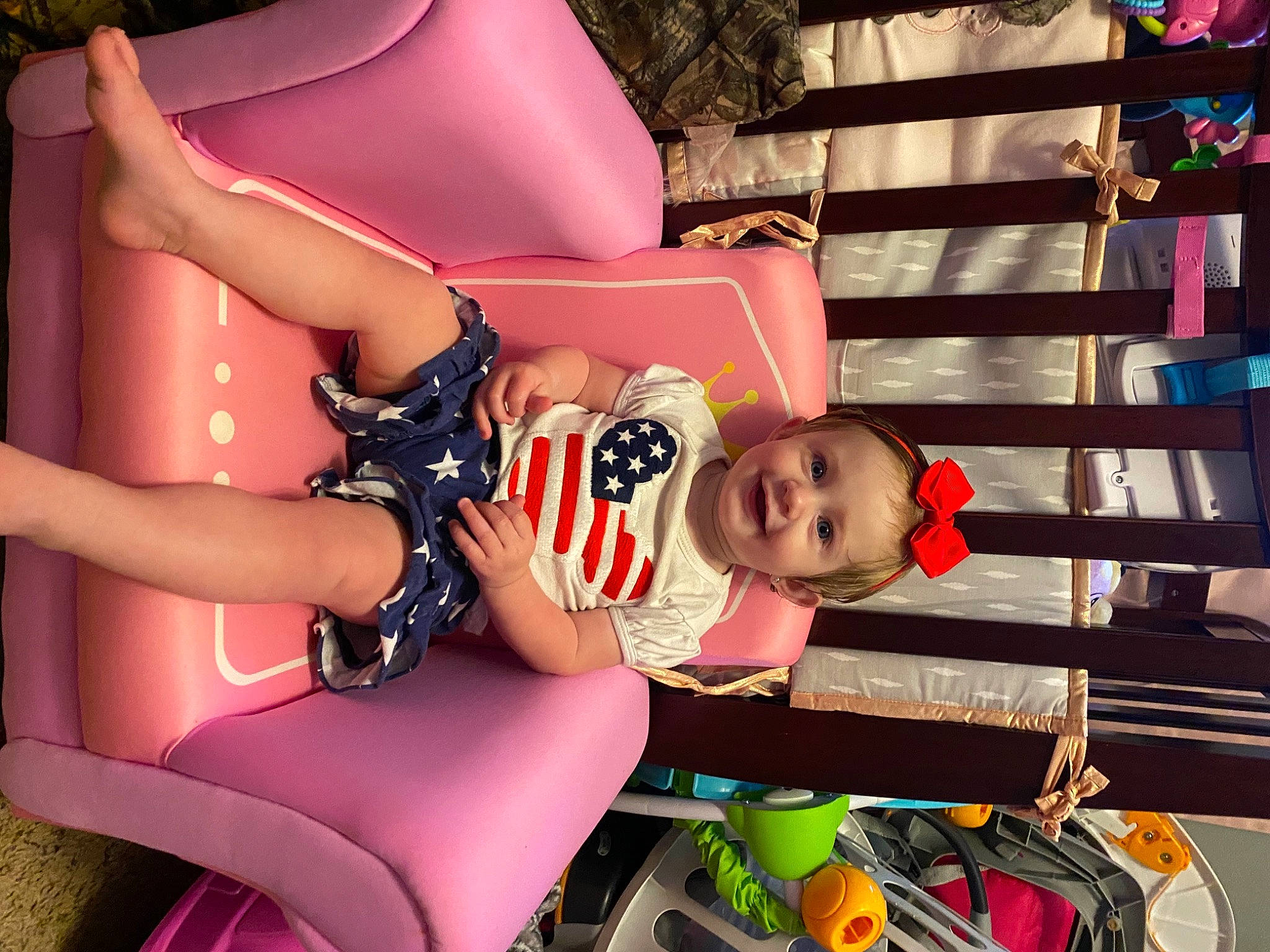 Maisie is registered to the contest to win money with this photo: baby, baby_toddler_clothing, child, foot, fun, happy, human_leg, joy, knee, leisure, magenta, person, pink, play, recreation, sandal, shoe, shorts, sitting, thigh