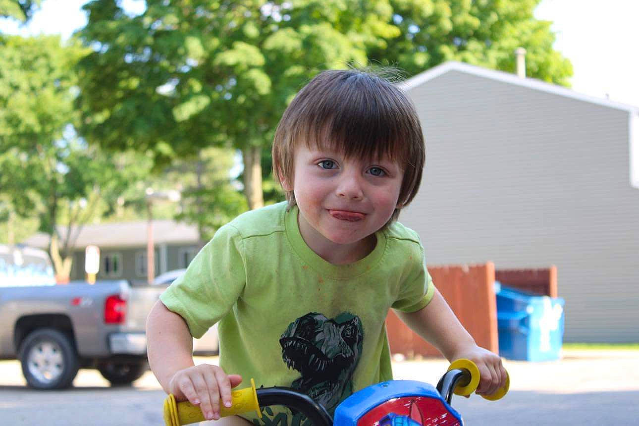 Liam is registered to the contest to win money with this photo: baby_playing_with_toys, car, child, city, coupe_utility, fun, grass, happy, joy, leisure, motor_vehicle, person, recreation, sitting, sky, smile, t_shirt, tire, toddler, tree