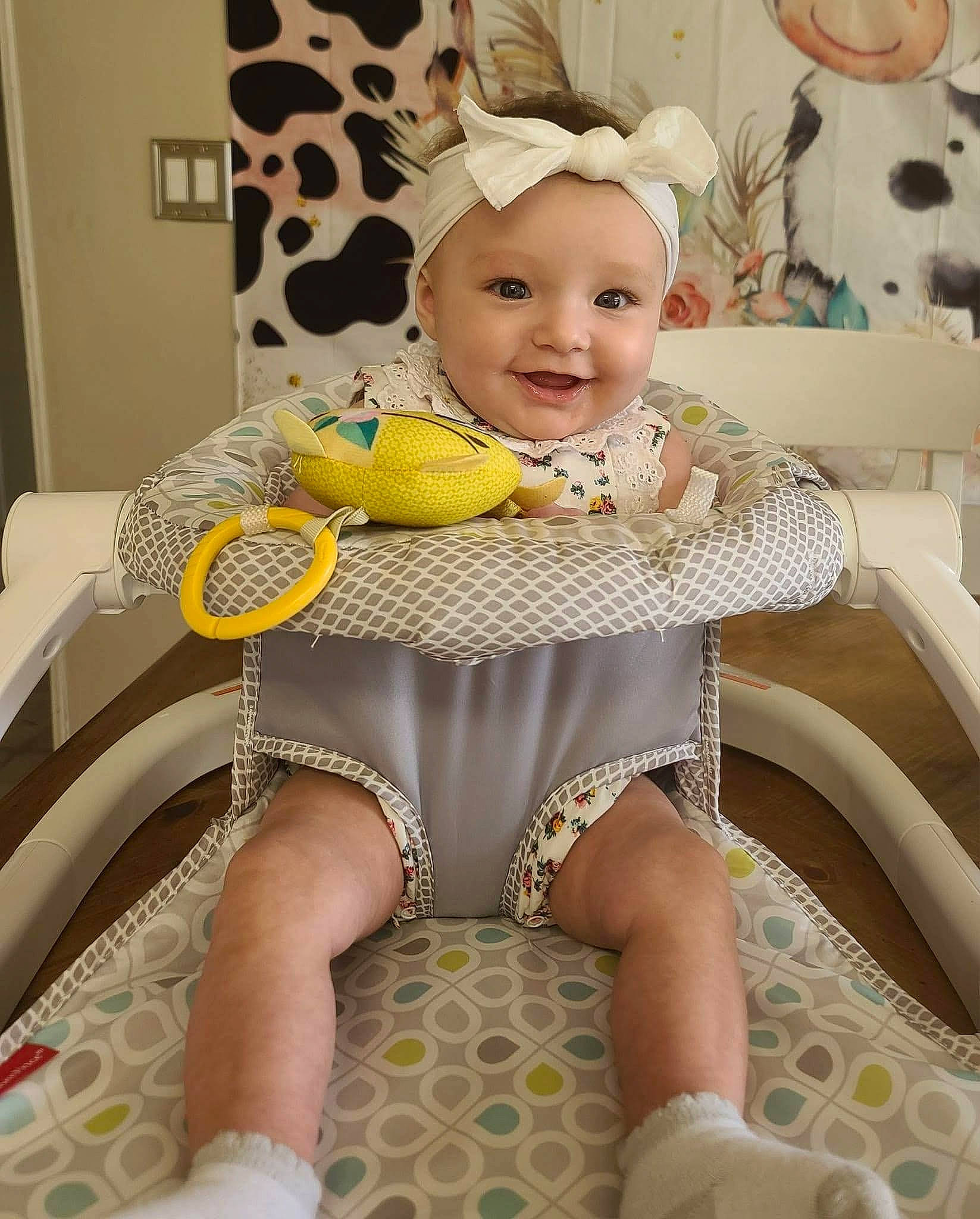 Charleigh is registered to the contest to win money with this photo: baby, baby_products, baby_toddler_clothing, chair, child, comfort, embellishment, fashion_accessory, happy, headgear, headwear, human_leg, joy, pattern, person, picture_frame, pink, sitting, sleeve, smile