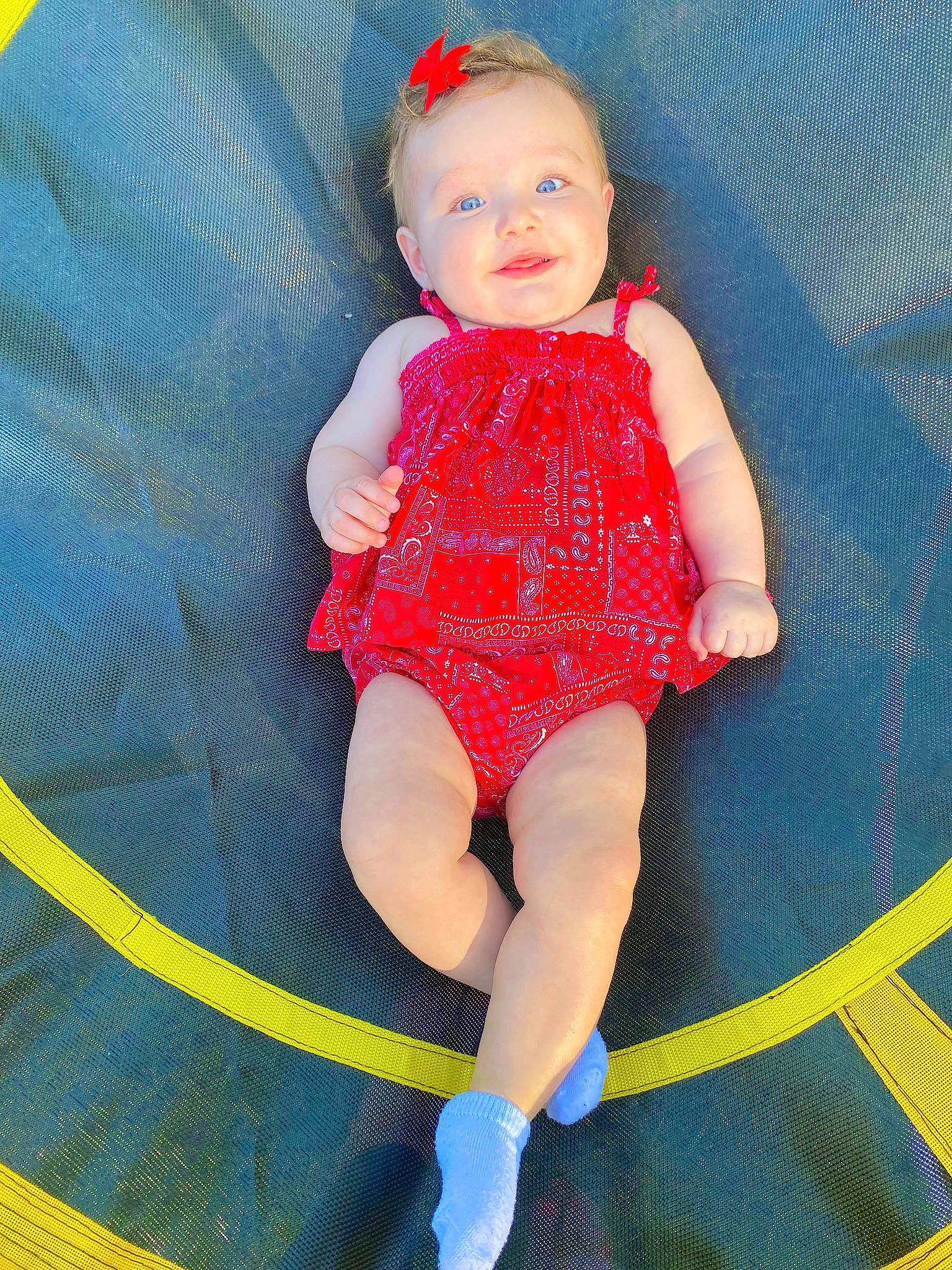 Charleigh is registered to the contest to win money with this photo: baby, baby_toddler_clothing, electric_blue, eye, face, finger, hand, head, human_body, knee, leg, person, pink, skin, sleeve, sock, textile, thigh, thumb, toddler