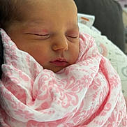 Haisley joined the competition — help win amazing prizes! newborn, baby, sleeping, blanket, pink, pattern, wrapped, peaceful, infant, closeup, face, skin, soft, cozy, indoors, portrait, child, young, rest, quiet