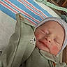 Bennett joined the competition — help win amazing prizes! newborn, baby, infant, sleeping, hospital, crib, swaddle, blanket, hat, striped_hat, face, portrait, closed_eyes, peaceful, onesie, clothing, medical_setting, nursery, bedding, photography