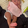 Jaliah joined the competition — help win amazing prizes! baby, infant, child, portrait, lying_down, blanket, pink_clothing, diaper, face, eyes, serious_expression, pouting, bare_feet, toes, pillow, bedding, indoors, cozy, closeup, photography
