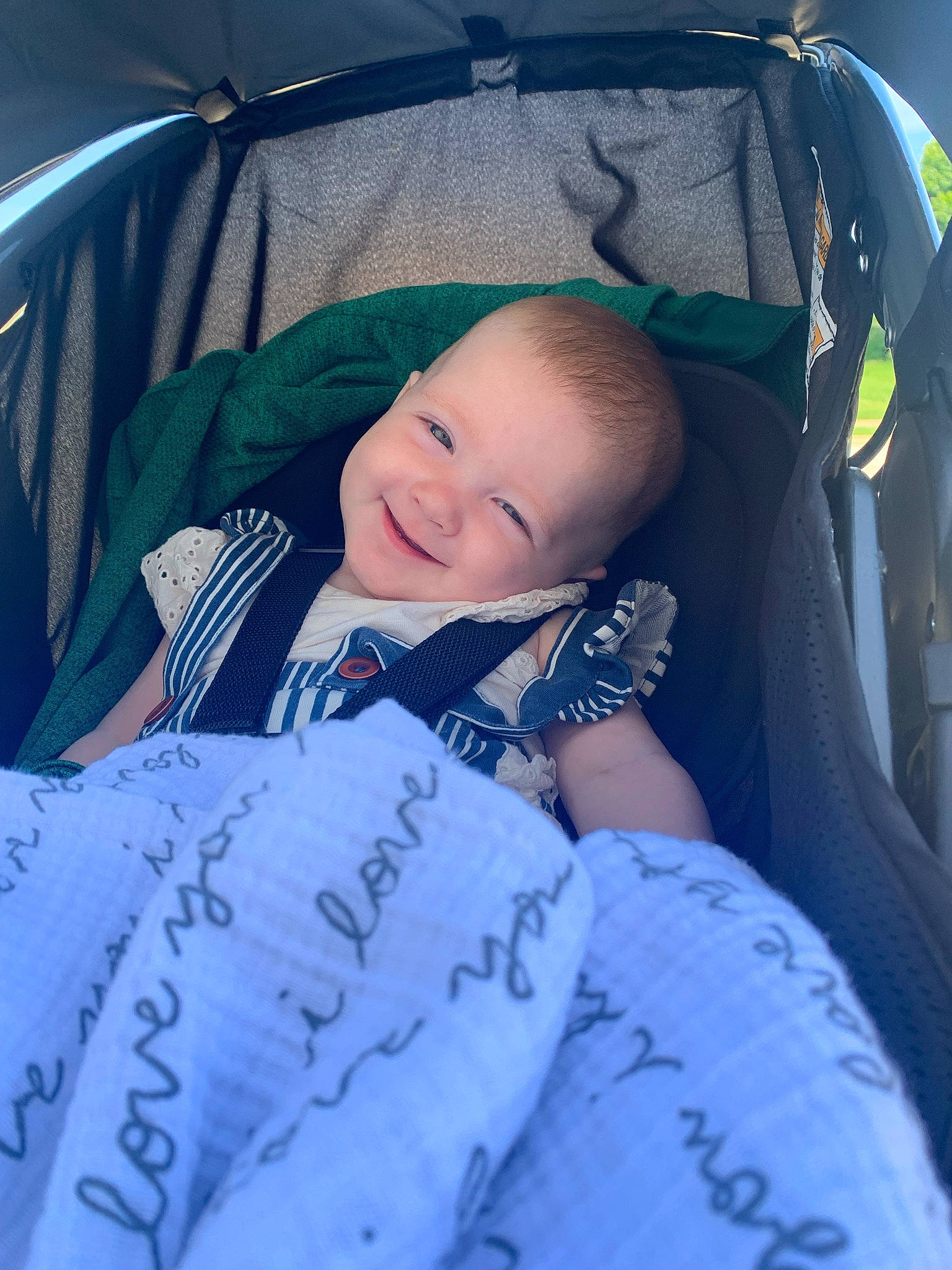 Penelope joined the competition — help win amazing prizes! baby, baby_carriage, baby_products, car_seat, child, comfort, electric_blue, facial_expression, finger, fun, grass, hand, happy, joy, lap, person, product, sitting, skin, smile