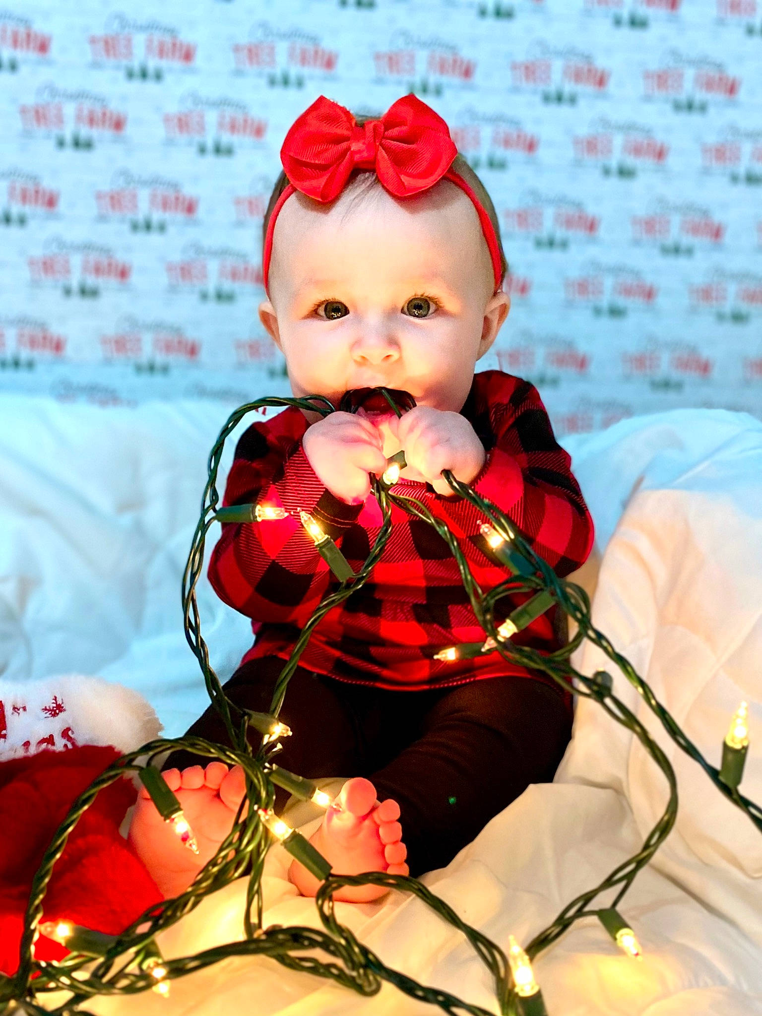 Charleigh joined the competition — help win amazing prizes! baby, carmine, child, christmas, doll, event, fashion_design, happy, headwear, holiday, lip, ornament, pattern, person, pink, plaid, red, sitting, tartan, textile