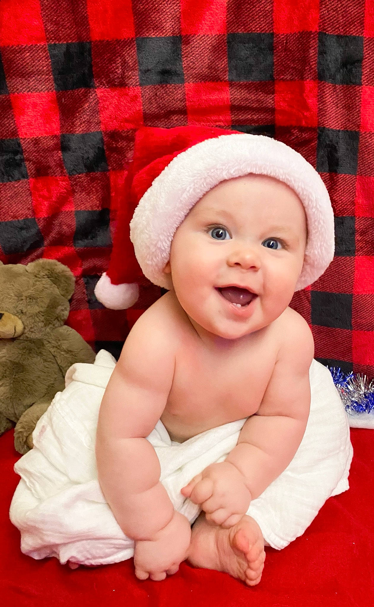 Grayson joined the competition — help win amazing prizes! baby, baby_toddler_clothing, child, christmas, christmas_eve, costume_accessory, costume_hat, facial_expression, fictional_character, happy, headwear, holiday, mouth, nose, pattern, person, plaid, pleased, red, tartan