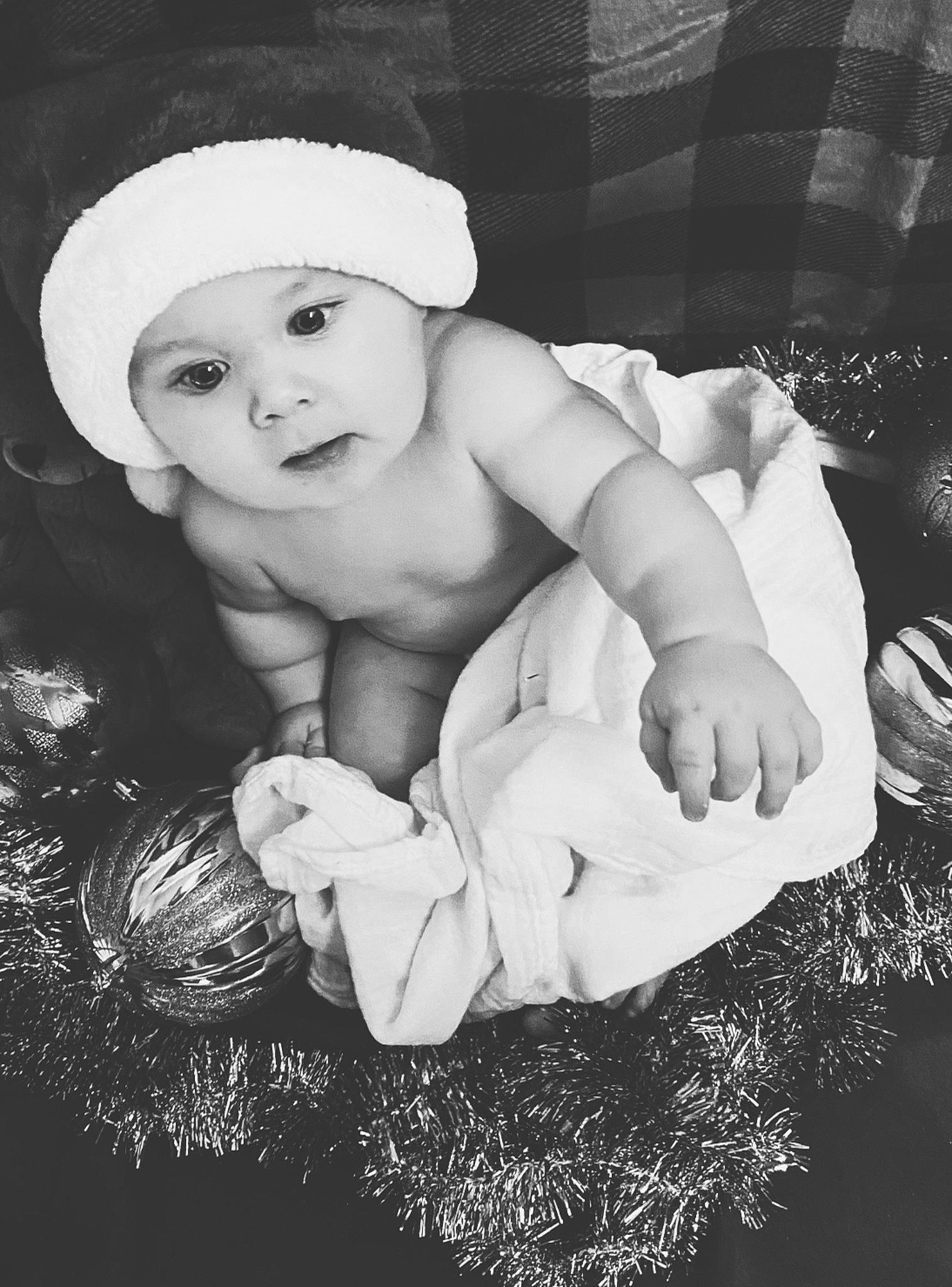 Grayson is registered to the contest to win money with this photo: baby, baby_toddler_clothing, bonnet, child, costume_accessory, foot, headwear, human, person, portrait_photography, stomach, toddler