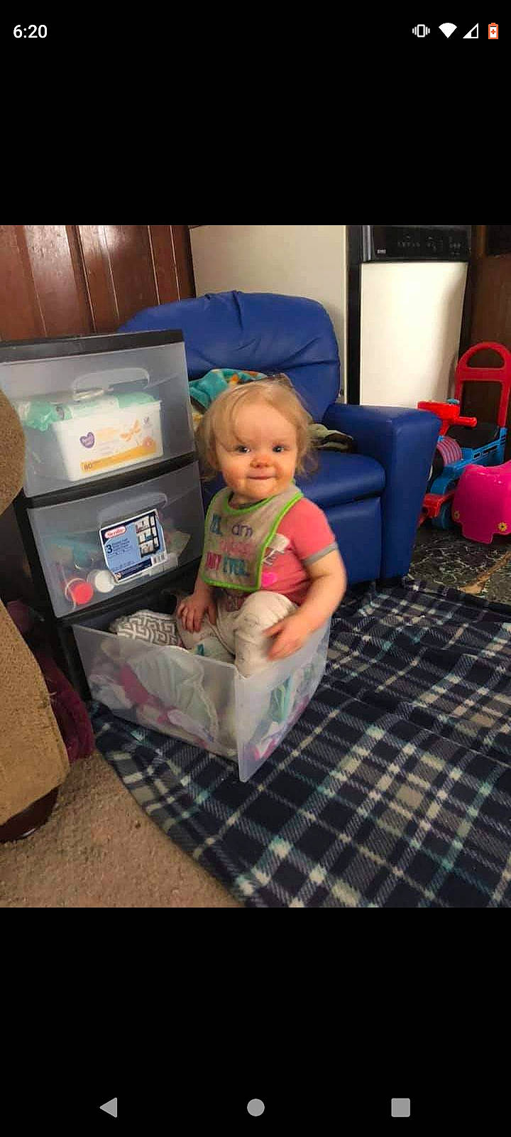 Nevaeh joined the competition — help win amazing prizes! arcade_game, baby, car_seat, child, comfort, display_device, flooring, fun, gadget, lap, leisure, living_room, machine, person, play, recreation, room, sitting, t_shirt, toddler