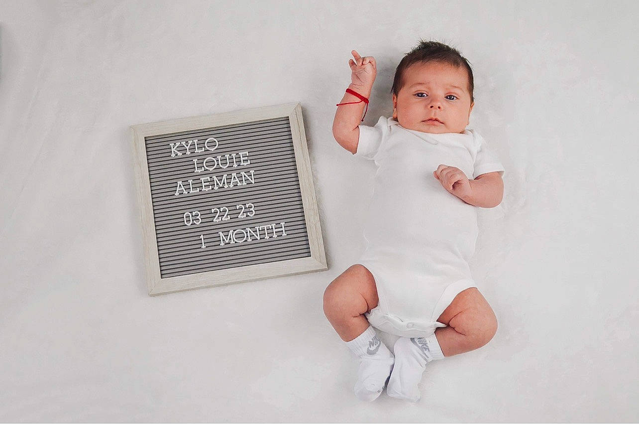 Louie joined the competition — help win amazing prizes! baby, baby_toddler_clothing, finger, flash_photography, font, foot, gesture, happy, human_leg, knee, pattern, person, portrait_photography, sitting, sleeve, thigh, thumb, toddler, wrist