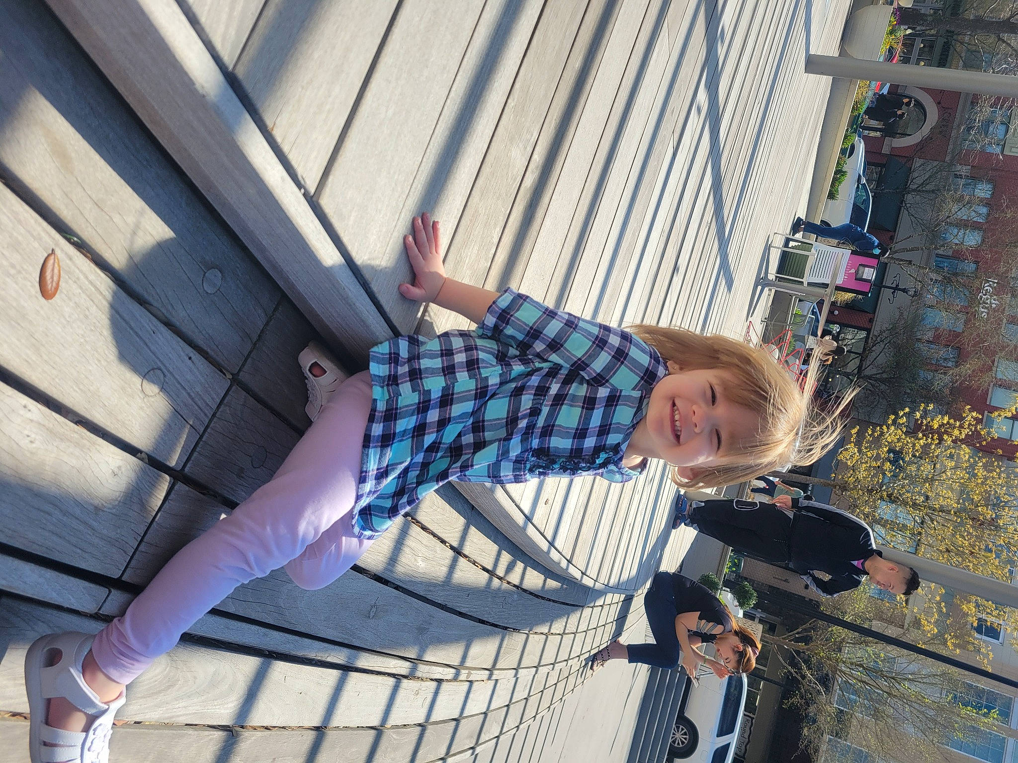 Leelah is registered to the contest to win money with this photo: city, electric_blue, eyewear, fun, human_leg, joy, knee, leisure, pattern, pedestrian, person, plaid, sandal, smile, street, street_fashion, tartan, textile, thigh, travel