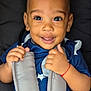 toddler, child, smiling, face, hands, car_seat, harness, blue_clothing, stars_pattern, baby, cute, portrait, young_child, happy, seatbelt, infant, closeup, person, sitting, indoors