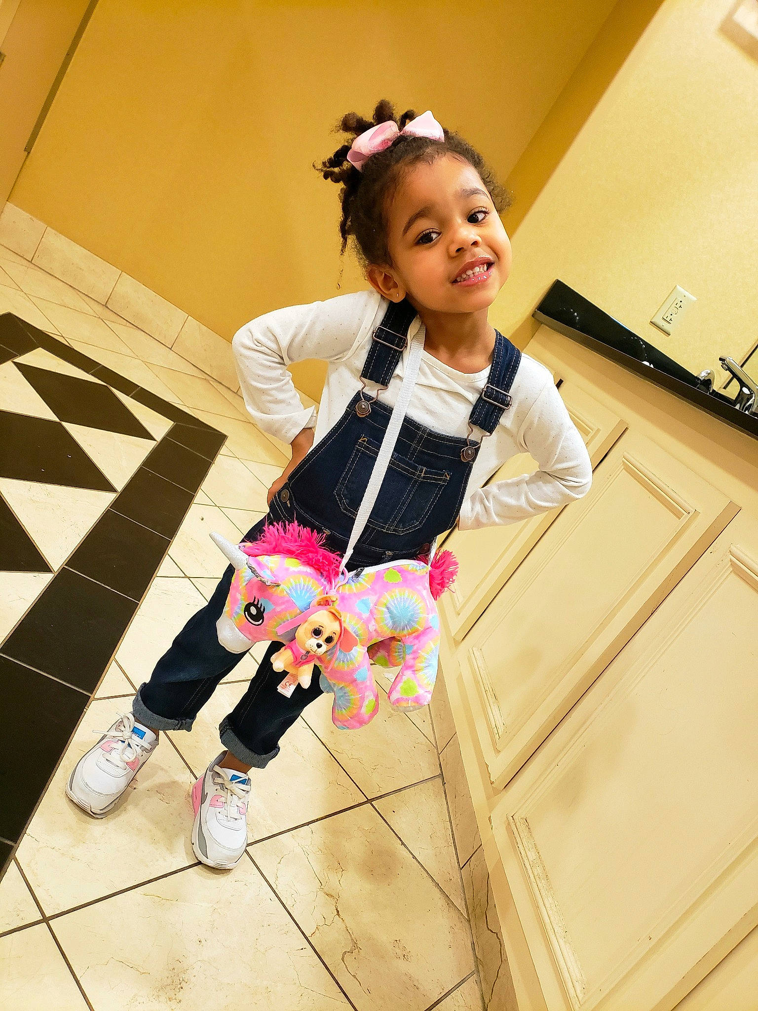 Taegan is registered to the contest to win money with this photo: baby_toddler_clothing, boot, child, fashion_accessory, fashion_design, floor, flooring, footwear, fun, happy, joy, leg, leisure, magenta, person, pink, sandal, sleeve, smile, sportswear