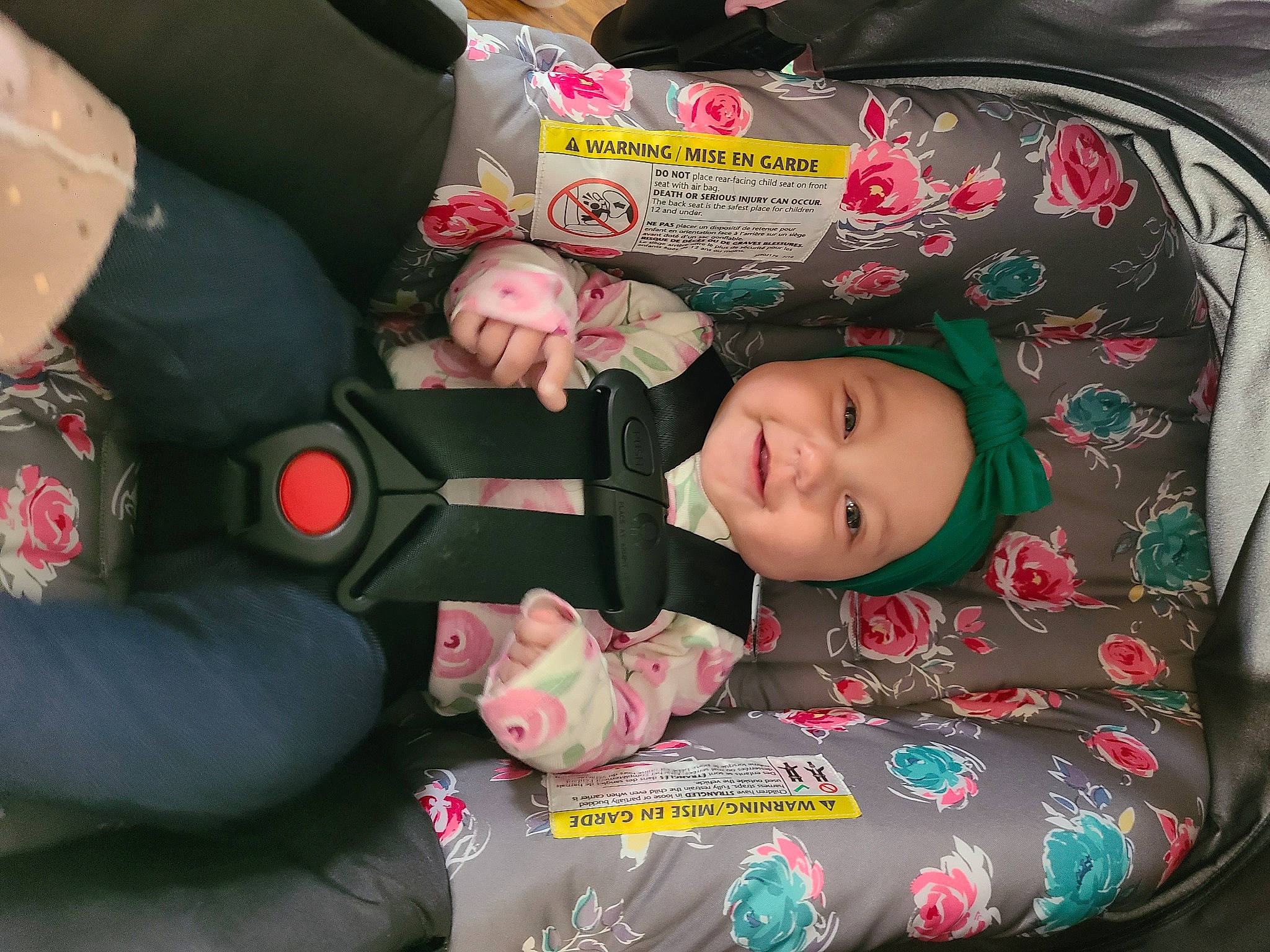 Adrianna joined the competition — help win amazing prizes! baby_carriage, baby_products, baby_toddler_clothing, bag, car_seat, child, comfort, green, head, headwear, joy, lap, person, sitting, smile, textile, toddler, travel
