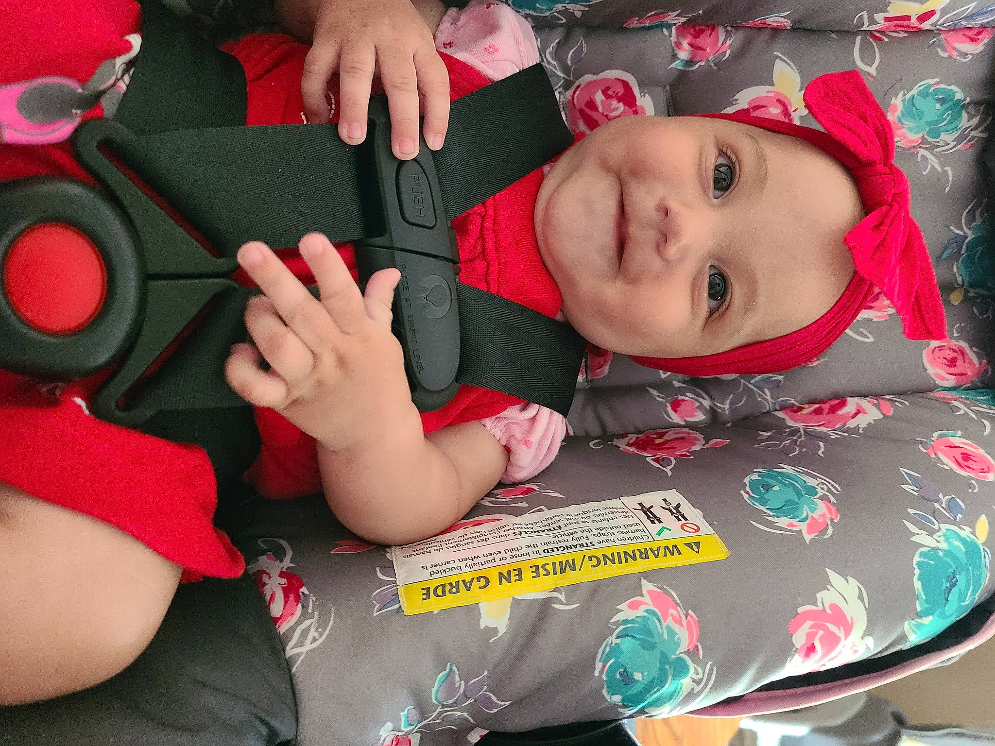 Adrianna is registered to the contest to win money with this photo: baby, baby_toddler_clothing, cheek, child, cool, face, finger, fun, gesture, happy, headwear, joy, mouth, nail, person, pink, product, red, skin, sleeve