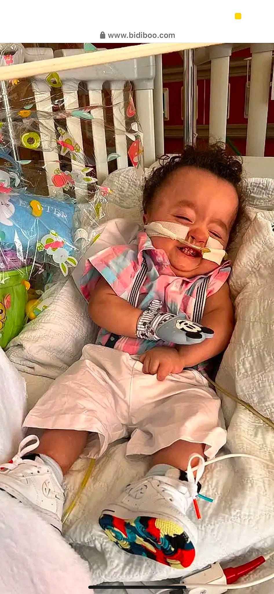 Leith is registered to the contest to win money with this photo: baby, baby_products, baby_toddler_clothing, cheek, child, comfort, eyewear, foot, fun, happy, human_leg, lap, linens, person, room, sitting, skin, smile, sock, thigh