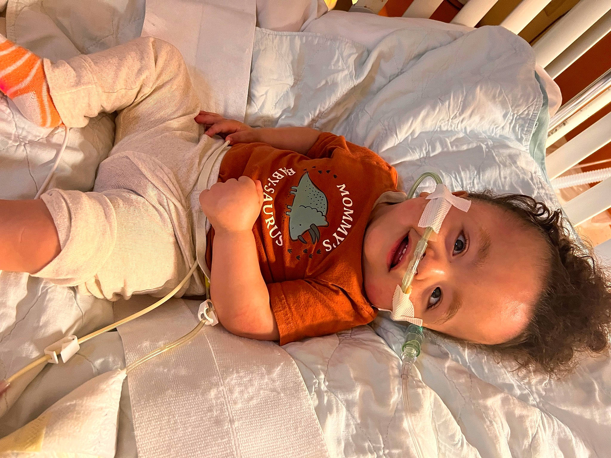 Leith joined the competition — help win amazing prizes! abdomen, bed, bedtime, child, comfort, couch, fun, happy, hat, human, human_body, human_leg, knee, linens, mouth, person, room, sitting, skin, thigh