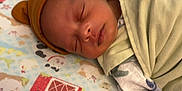 Kyrie joined the competition — help win amazing prizes! newborn, baby, sleeping, blanket, hat, bed, animal_print, barn, infant, cute, peaceful, child, indoors, soft, swaddle, nursery, rest, face, cozy, baby_bedding