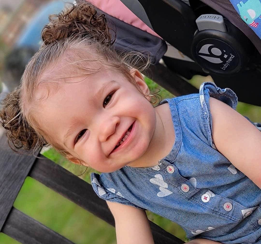 Leia joined the competition — help win amazing prizes! auto_part, automotive_tire, baby_toddler_clothing, blond, child, cool, electric_blue, fun, grass, hairstyle, happy, joy, leisure, lip, person, recreation, sitting, skin, smile, tire