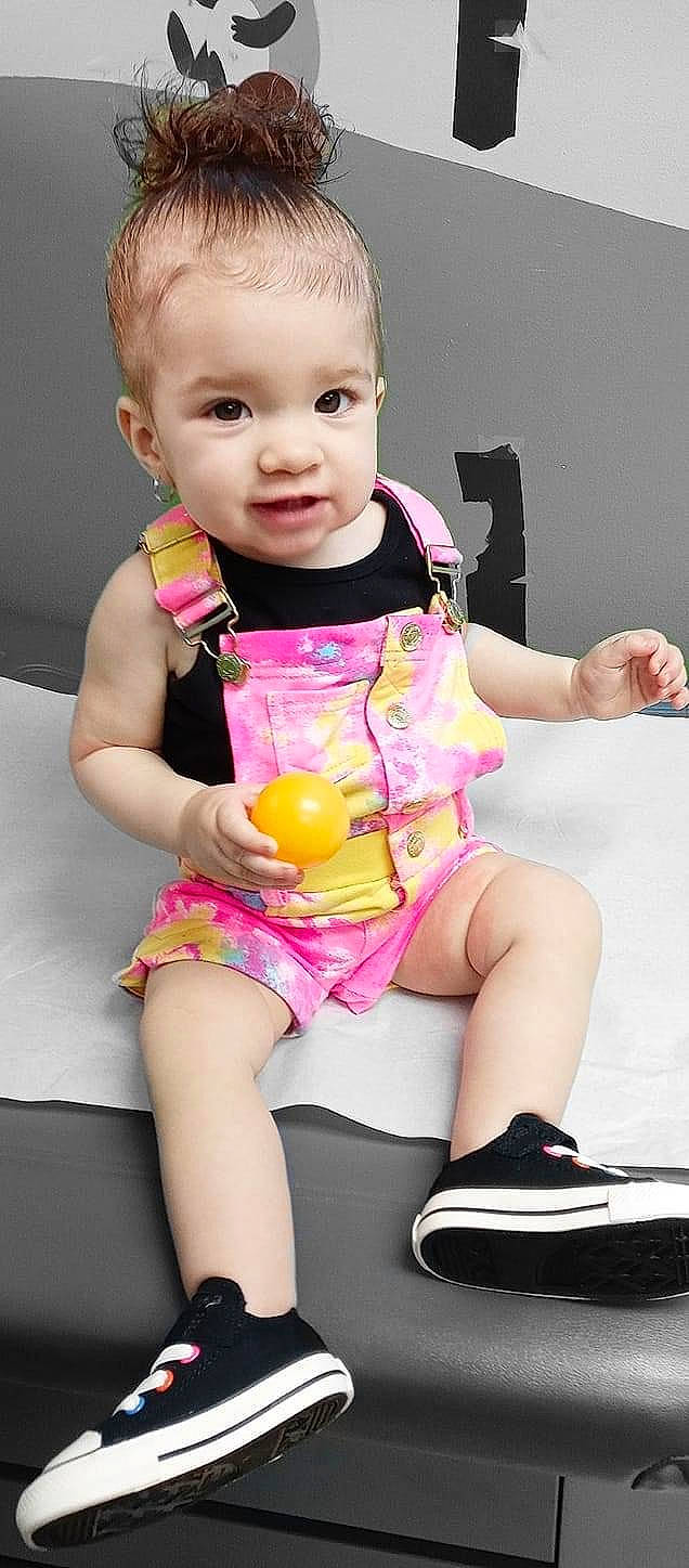 Leia is registered to the contest to win money with this photo: baby, baby_toddler_clothing, beauty, clothing, eye, happy, head, joint, leg, magenta, organ, people, person, pink, plant, skin, snapshot, thigh, toddler, white