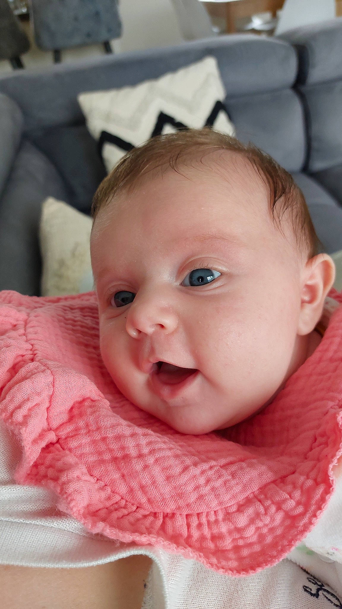 Rose participe au concours pour gagner de l'argent avec cette photo : baby, baby_toddler_clothing, cheek, child, chin, comfort, eyebrow, eyelash, happy, iris, linens, lip, mouth, nose, person, pink, portrait_photography, sitting, skin, smile