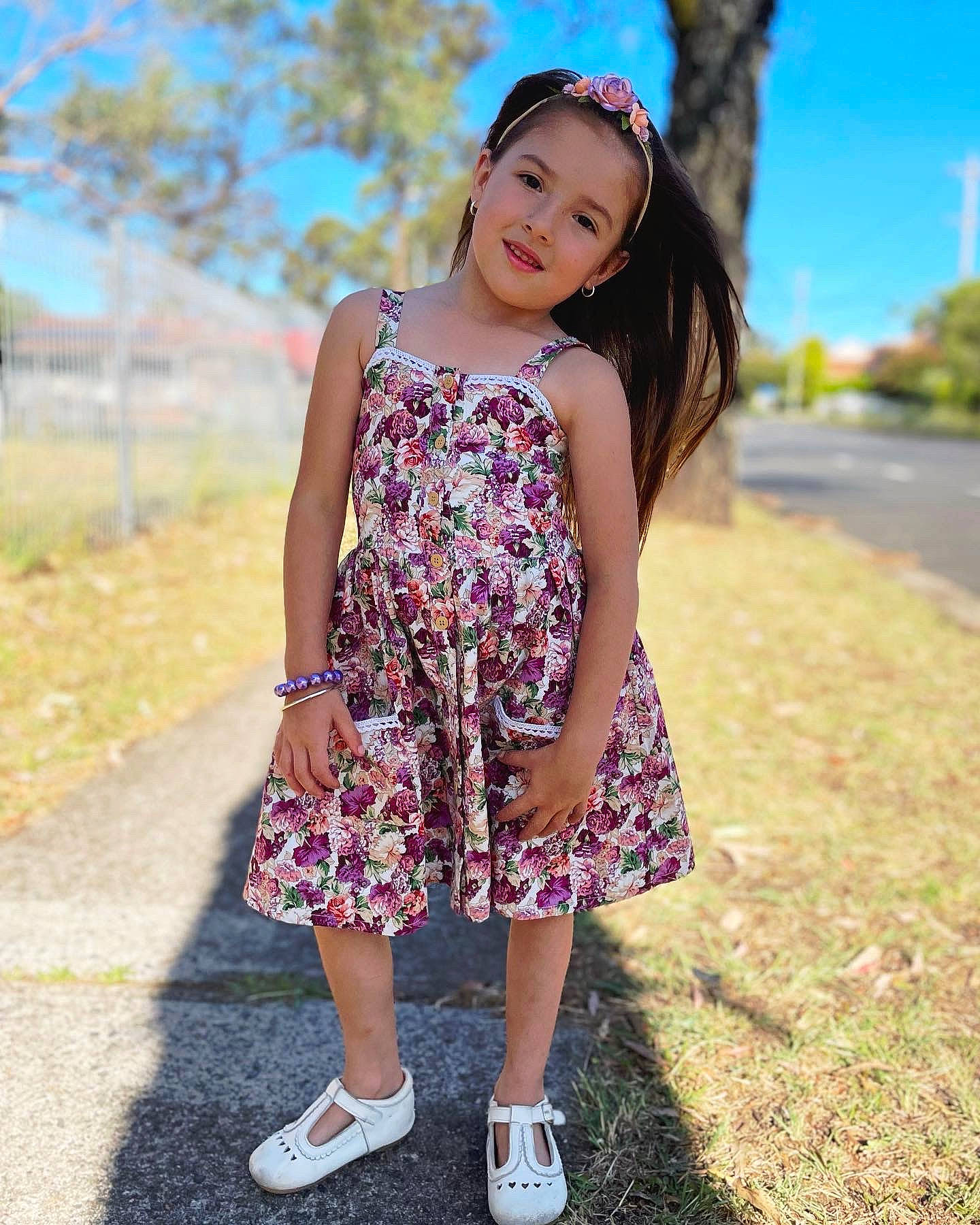 Ariel is registered to the contest to win money with this photo: day_dress, dress, electric_blue, fashion_design, fawn, flash_photography, grass, happy, head, joy, leg, magenta, one_piece_garment, people_in_nature, person, pink, plant, sky, sleeve, summer