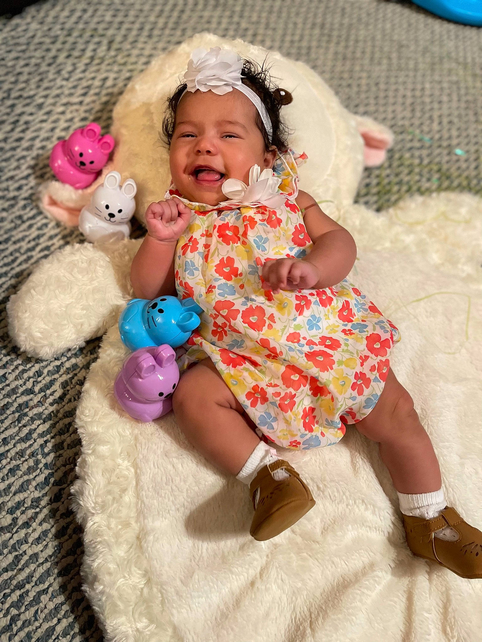 Skyelar is registered to the contest to win money with this photo: baby, baby_products, baby_toddler_clothing, blue, child, comfort, event, fashion_accessory, fawn, happy, head, headwear, linens, magenta, pattern, person, pink, sitting, skin, sleeve