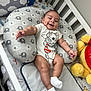 baby, bed, blanket, clothing, crib, cushion, face, furniture, happy, head, homedecor, hosiery, indoors, infantbed, newborn, person, photography, pillow, portrait, sock